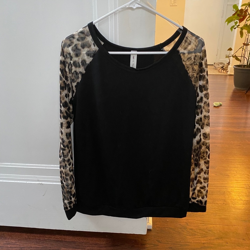 Black top with sheer animal print sleeves